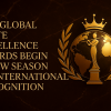 Luxurious bronze-and-gold globe with the Global Flute Excellence Awards logo reflected on its surface, symbolizing worldwide flute recognition.